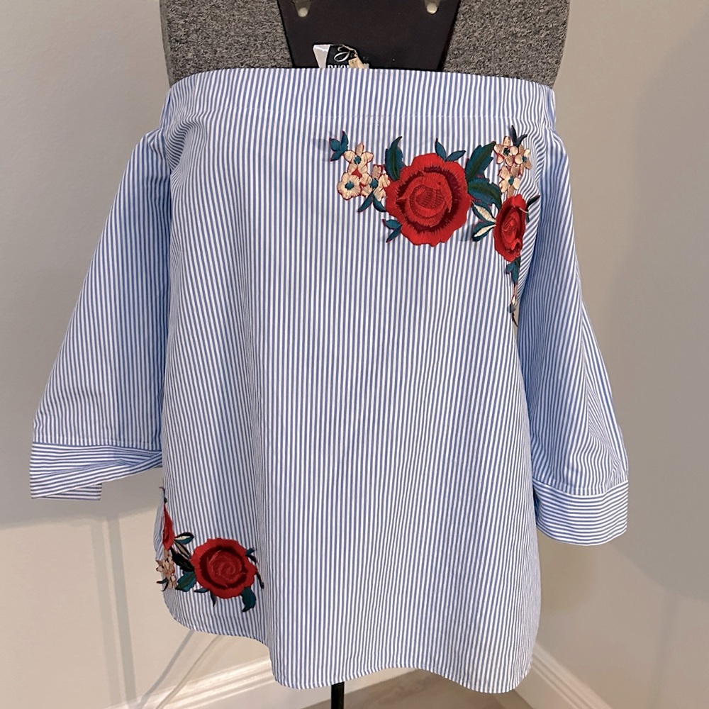 Blue and white striped with rose appliqué off shoulder shirt.